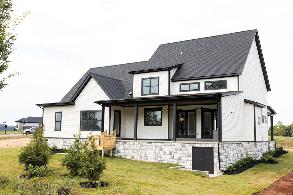 Custom-built home exterior at Tennessee National with landscaped yard and mountain backdrop