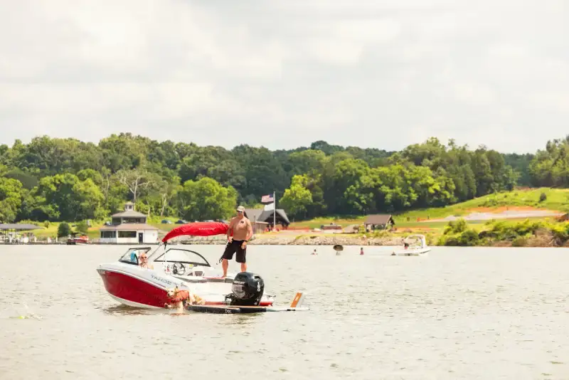 Group enjoying pontoon cruise on Tennessee National lake